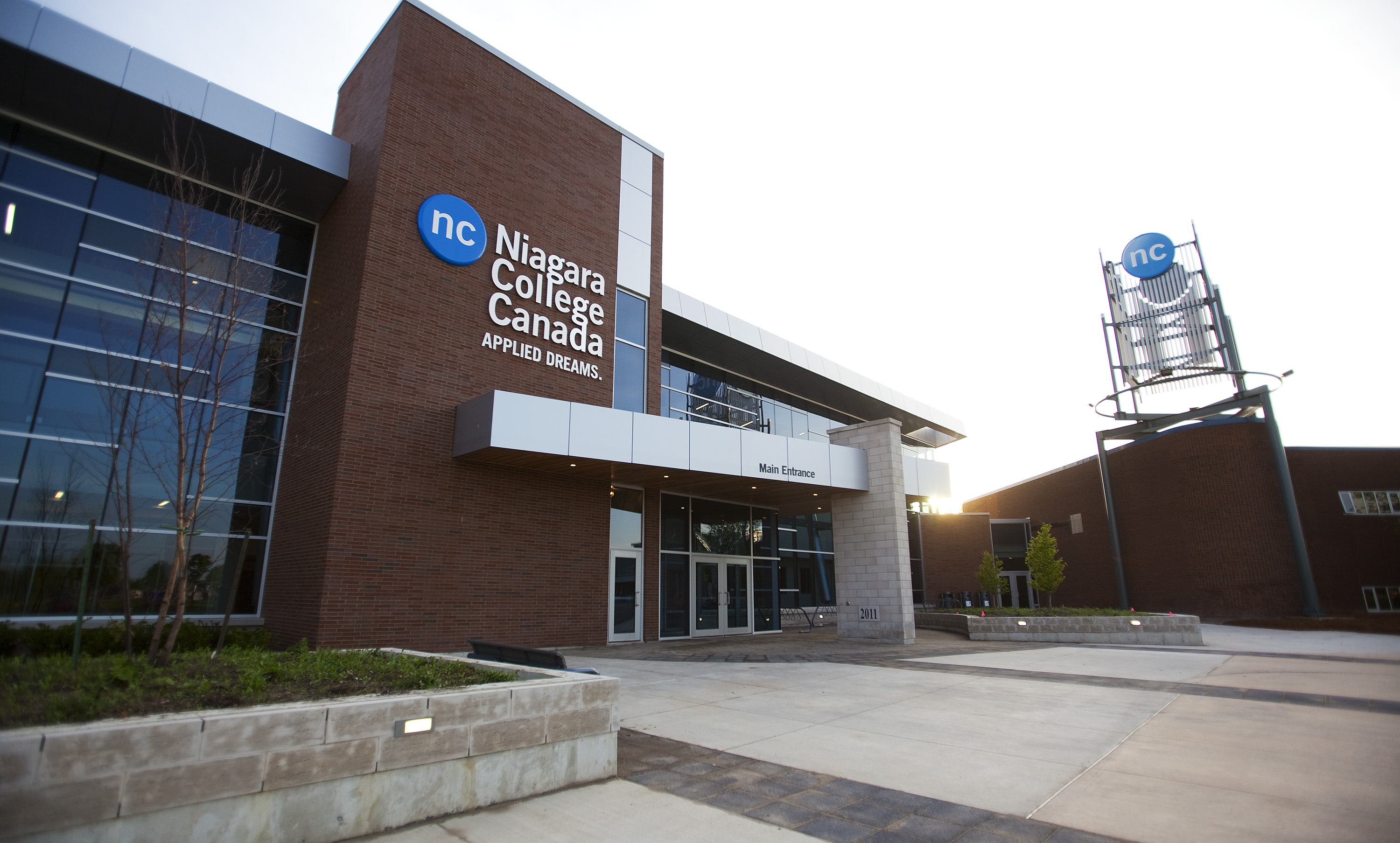 This image is a picture outside of the Welland campus front entrance and text that reads Niagara College